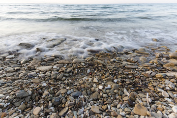 sea waves on the stone beach at sunset, Zakynthos, Greece