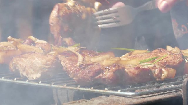 Close up of Pork Meat Steak on Barbecue Grill