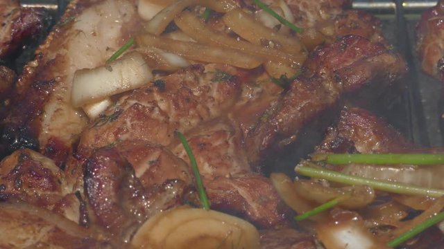 Close up of Pork Meat Steak on Barbecue Grill