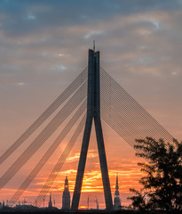 Morning silhouettes of Riga - the capital and largest city of Latvia, a major commercial, cultural, historical and financial center of the Baltic region 