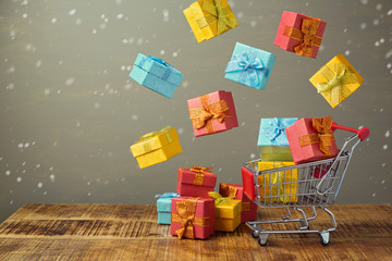 Christmas holiday sale concept with shopping cart and gift boxes