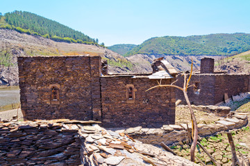 landscapes of  Ruins of the village of Chave (normally submerged), strains and terraces of vineyards in the Ribeira Sacra,  Galicia, Spain