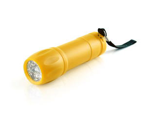 gold plastic cylinder flashlight with led light and black strap isolated on white