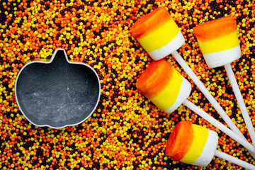 Halloween background - candy corn marshmallow pop