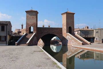 Fototapeta na wymiar Ponte dei Sisti,treponti,Comacchio,Italia,piccola venezia,three bridges, Comacchio, Italy,Little Venice