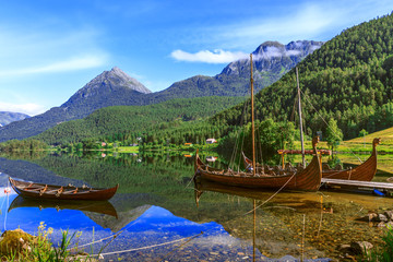 Old viking boats replica in a norwegian landscape - 120958990