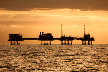 Silhouette of offshore oil installation