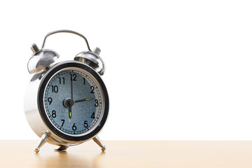 alarm clock on the table on white background.