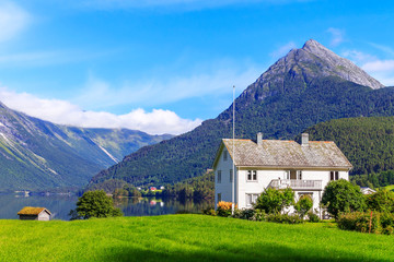 Typical country house in Beautiful Norway natural landscape