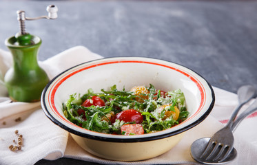 Vegetable salad, mixed cherry tomatoes with Parmesan cheese and arugula.selective focus.