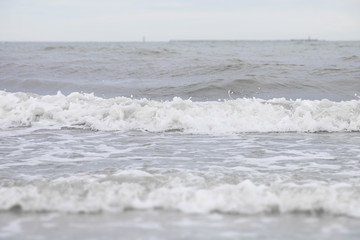 Soft wave of the sea on the beach.