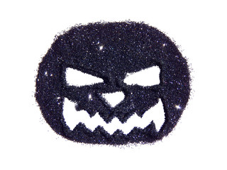 Abstract pumpkin with scary snout of black glitter, festive Halloween symbol, icon