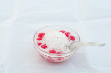 Colorful candies dumplings in coconut cream with sweet poached egg, Thai Sweet