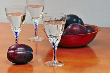 Glasses of homemade plum brandy