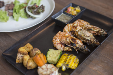Fried shrimps on a plate with vegetables