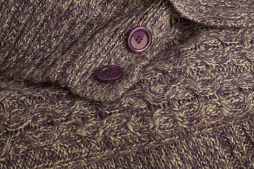 Fragment of  violet  knitting wool sweater