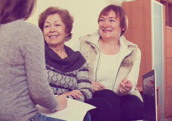 Senior women consulting with banking agent