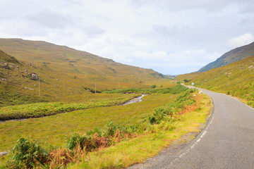 Fototapeta na wymiar Scottish road trough countryside