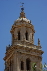 Fototapeta na wymiar The bell tower of The Assumption of the Virgin Cathedral in Jaen, Spain
