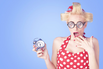 Portrait surprised business woman with alarm clock 