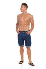 Fototapeta premium Handsome Man In Jeans Shorts And Sandals