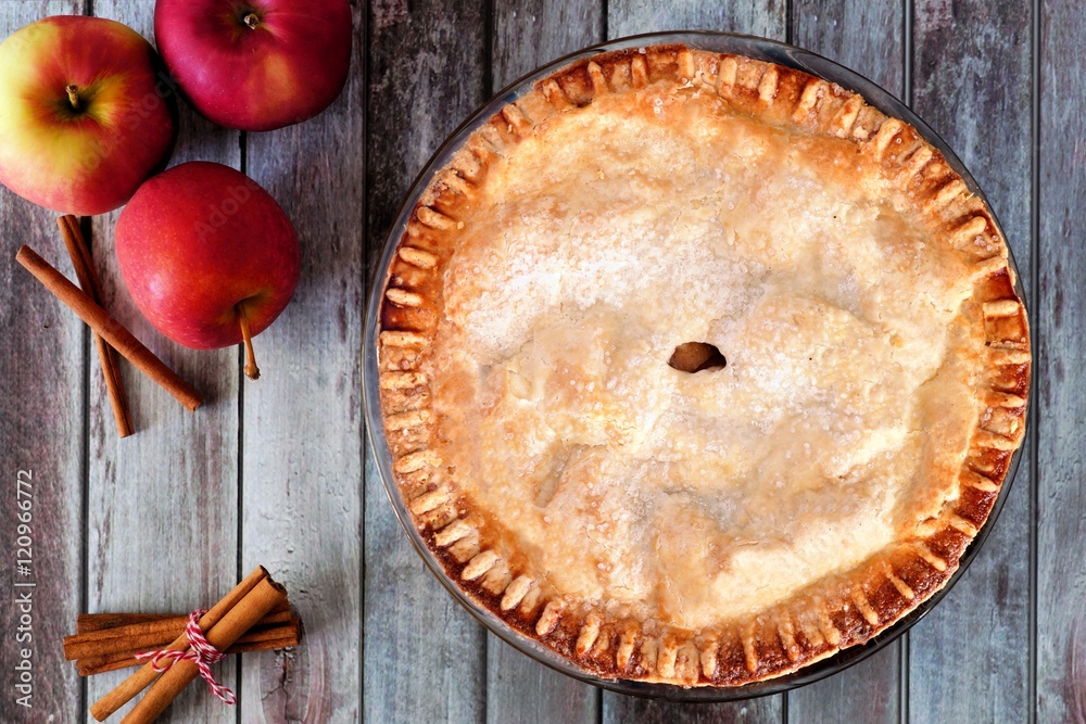 Aufkleber delicious autumn apple pie, overhead table scene on a rustic wood background