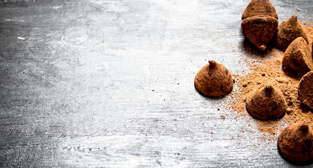 Chocolate truffles with cocoa.