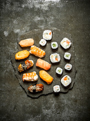 Sushi with tuna, shrimp, salmon and rolls.