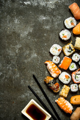 Sushi rolls with seafood and soy sauce.