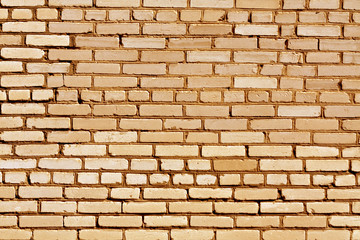 Weathered orange brick wall texture.
