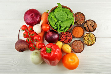 Vegetables and spices on wooden table