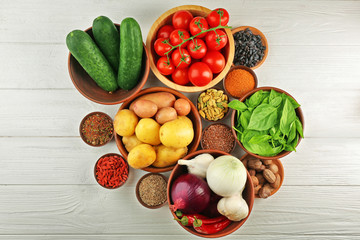Vegetables and spices on wooden table