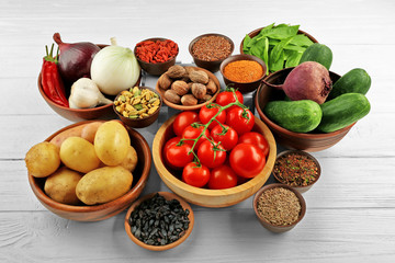 Vegetables and spices on wooden table