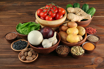 Vegetables and spices on wooden table