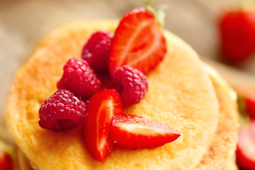 Tasty pancakes with fresh berries, closeup