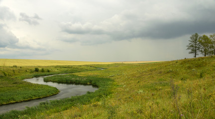 Fototapeta na wymiar Cloudy landscape.River Krasivaya Mecha in Tula region,Russia.
