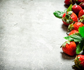 Strawberry with green leaves.