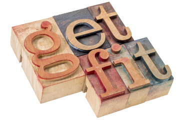 get fit word abstract in wood type