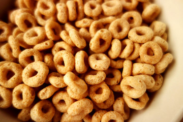 Cheerios - Bowl with cheerios whole grain cereals. 