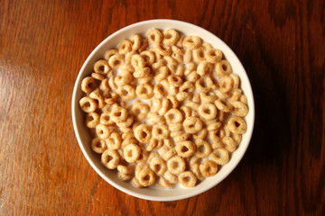 Cheerios - Bowl with cheerios whole grain cereals. 