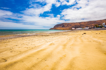 Fishing village Pozo Negro with stone and sand beach, Fuerteventura, Canary Island, Spain.