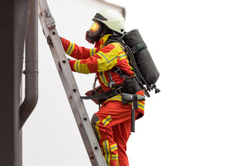 Fireman in action, climbing a stair