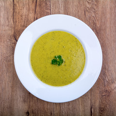 Cream of broccoli soup on a plate