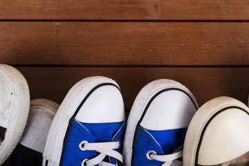 Old canvas shoes on a wooden floor