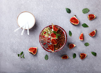 Granola with yogurt, Chia seeds,Goji berries,pumpkin seeds, fresh figs and honey.A vegetarian Breakfast.Food or Healthy diet concept.selective focus.