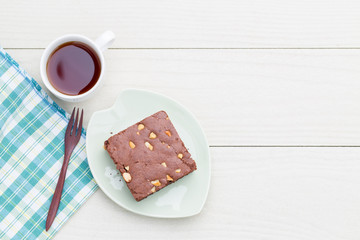 Cake chocolate brownie on white wooden background,top view