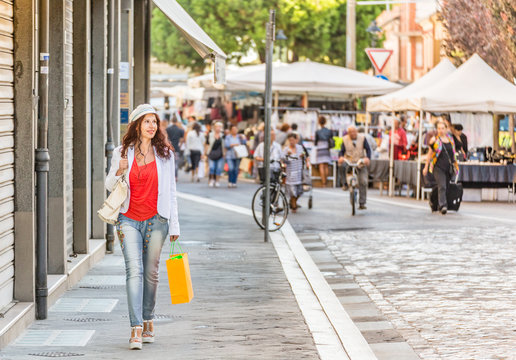 Fototapeta woman shopping in Italian street market
