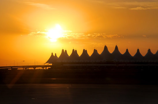 Denver airport against sun set background