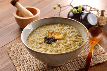 Noodle of Jeonbokjuk in bowl with ginger on the table