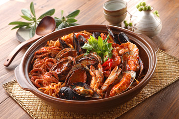 Steamed kimchi seafood with abalone, blue mussel, octopus, crab